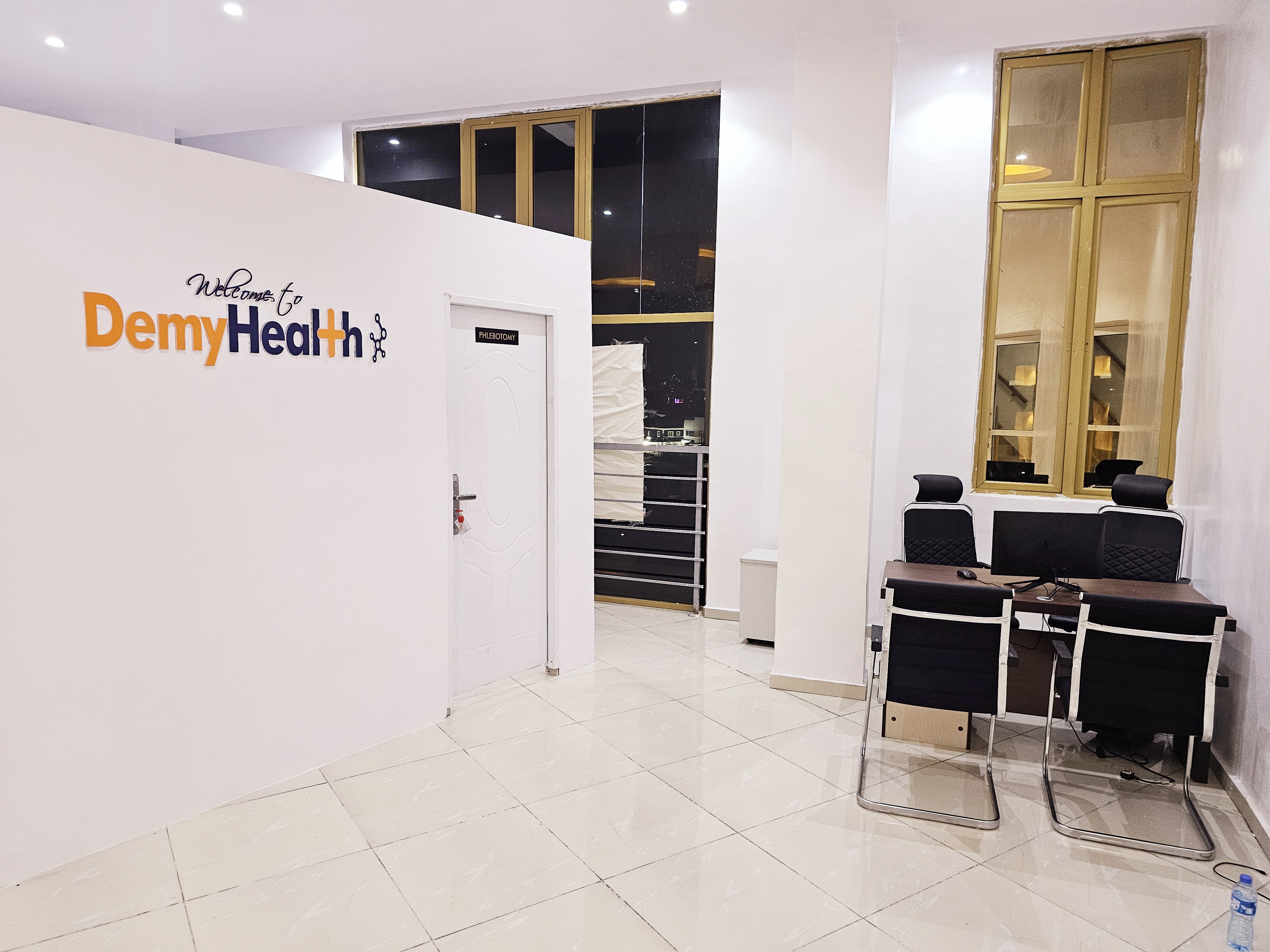 African healthcare professionals and patients in a DemyHealth-themed setting